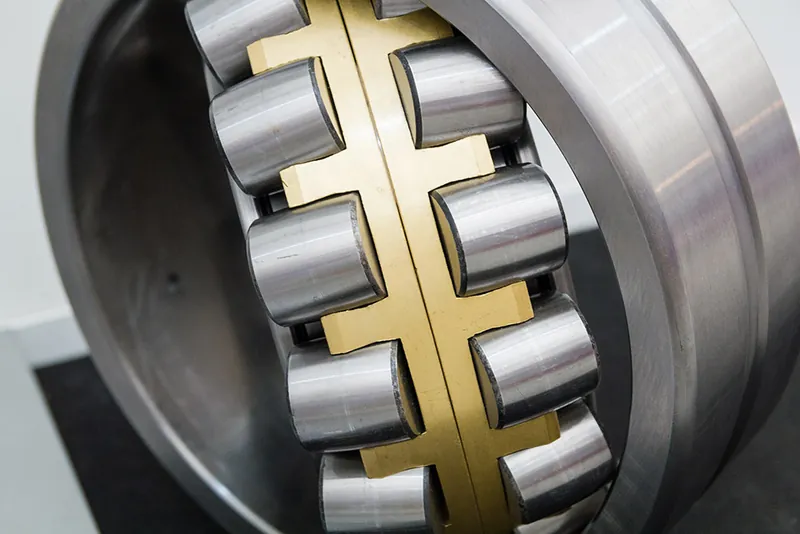 Close-up of a roller bearing with a brass cage